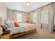 Cozy bedroom featuring a wooden bed frame and natural light from the windows at 1013 N Bask Dr, Tampa, FL 33603