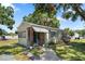 Charming single-story home with brick accents, inviting front entrance, and well-maintained landscaping at 1013 N Bask Dr, Tampa, FL 33603