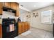 Kitchen featuring wooden cabinets, and black appliances at 1013 N Bask Dr, Tampa, FL 33603