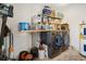 Laundry room features front load washer and dryer and ample storage shelves for organization at 1013 N Bask Dr, Tampa, FL 33603