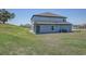 View of the backyard and rear exterior at 10517 Crestview Heights Ave, Thonotosassa, FL 33592