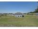 Beautiful view of the backyard featuring a well-maintained lawn at 10517 Crestview Heights Ave, Thonotosassa, FL 33592