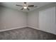 Bedroom featuring gray walls, carpeted floor, and a ceiling fan at 10517 Crestview Heights Ave, Thonotosassa, FL 33592