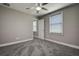 Bedroom featuring carpet, neutral paint, a ceiling fan, and one window at 10517 Crestview Heights Ave, Thonotosassa, FL 33592