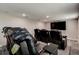 Spacious home theater with black leather reclining chairs, providing a luxurious viewing experience at 10517 Crestview Heights Ave, Thonotosassa, FL 33592