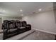 Home theater room with multiple black leather recliners set up for immersive entertainment at 10517 Crestview Heights Ave, Thonotosassa, FL 33592
