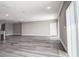 Bright living area with recessed lighting and sliding glass door at 10517 Crestview Heights Ave, Thonotosassa, FL 33592