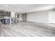 Bright and spacious living room features luxury vinyl plank flooring and recessed lighting at 10517 Crestview Heights Ave, Thonotosassa, FL 33592