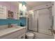This well-lit bathroom has a shower over tub, white subway tile, and modern fixtures at 1065 Tartan Dr # C, Palm Harbor, FL 34684