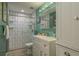 Bathroom with walk-in shower, modern fixtures, and bright white vanity at 1065 Tartan Dr # C, Palm Harbor, FL 34684