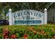 Greenview Villas community sign surrounded by lush landscaping and flowers at 1065 Tartan Dr # C, Palm Harbor, FL 34684