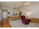 Comfortable dining room featuring a cathedral ceiling and view into the kitchen at 1065 Tartan Dr # C, Palm Harbor, FL 34684