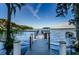 A private boat dock extends into the serene lake, offering direct water access for boating and recreation at 1065 Tartan Dr # C, Palm Harbor, FL 34684
