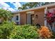 Inviting front entrance with stone accents and lush landscaping creates great curb appeal at 1065 Tartan Dr # C, Palm Harbor, FL 34684