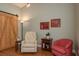 Comfortable living room featuring a barn door, arm chairs, and hardwood floors at 1065 Tartan Dr # C, Palm Harbor, FL 34684