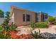 A tranquil backyard featuring meticulous landscaping, winding pathways, and direct access to the screened lanai at 1126 Haley Ln, Dunedin, FL 34698