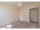 Inviting carpeted bedroom with a ceiling fan, providing a comfortable and relaxing atmosphere at 1126 Haley Ln, Dunedin, FL 34698
