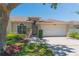 Charming single-story home with manicured lawn, a two car garage and inviting front porch at 1126 Haley Ln, Dunedin, FL 34698