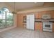 Bright kitchen with ample cabinet space, stainless steel appliances, and a large window at 1126 Haley Ln, Dunedin, FL 34698