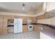 Spacious kitchen featuring ample cabinetry, stainless steel appliances, and tile flooring at 1126 Haley Ln, Dunedin, FL 34698