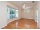 Spacious living room features a large bay window and ceiling fan at 1126 Haley Ln, Dunedin, FL 34698
