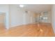 Open-concept living area featuring wood floors and views into other rooms at 1126 Haley Ln, Dunedin, FL 34698