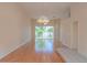 Bright living room featuring hardwood floors, natural lighting and a decorative chandelier at 1126 Haley Ln, Dunedin, FL 34698
