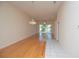 Bright living room featuring hardwood floors, natural lighting and a decorative chandelier at 1126 Haley Ln, Dunedin, FL 34698