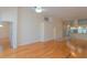 Open-concept living area featuring wood floors and views into other rooms at 1126 Haley Ln, Dunedin, FL 34698