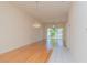 Bright living room featuring hardwood floors, natural lighting and a decorative chandelier at 1126 Haley Ln, Dunedin, FL 34698