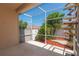 A screened-in patio offers scenic views of the backyard's lush landscaping and winding pathways at 1126 Haley Ln, Dunedin, FL 34698
