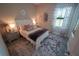 Charming bedroom with a comfortable bed, elegant decor, and plenty of natural light at 13103 Monach Isles Dr, Riverview, FL 33579