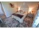 Charming bedroom with a comfortable bed, elegant decor, and plenty of natural light at 13103 Monach Isles Dr, Riverview, FL 33579