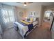 Stylishly decorated bedroom with a window that provides natural light at 13103 Monach Isles Dr, Riverview, FL 33579
