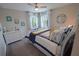 Nautical themed bedroom with a decorative compass and nautical artwork at 13103 Monach Isles Dr, Riverview, FL 33579