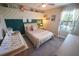 Comfortable bedroom with soft neutral decor, a crib, and windows with natural light at 13103 Monach Isles Dr, Riverview, FL 33579