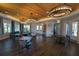 Beautiful clubhouse featuring wood ceilings, elegant lighting, comfortable seating, and community tables at 13103 Monach Isles Dr, Riverview, FL 33579