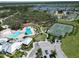 Community amenities featuring a pool, tennis courts, clubhouse, and ample green space at 13103 Monach Isles Dr, Riverview, FL 33579