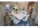 Elegant dining room with seating for ten, chandelier and stylish decor with open floor plan at 13103 Monach Isles Dr, Riverview, FL 33579