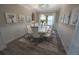 Elegant dining room with seating for ten, chandelier and stylish decor with open floor plan at 13103 Monach Isles Dr, Riverview, FL 33579