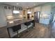 Spacious kitchen features an island with seating, stainless steel appliances, and modern lighting at 13103 Monach Isles Dr, Riverview, FL 33579