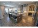 Modern kitchen features a large island with seating, stainless steel appliances, and decorative tile backsplash at 13103 Monach Isles Dr, Riverview, FL 33579