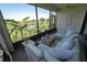 Relaxing screened-in lanai with comfortable seating and beautiful pond views at 13103 Monach Isles Dr, Riverview, FL 33579