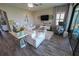 Cozy living room with stylish white furniture and elegant décor at 13103 Monach Isles Dr, Riverview, FL 33579
