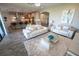 Open-concept living room flows into kitchen area and offers an inviting space for entertaining at 13103 Monach Isles Dr, Riverview, FL 33579