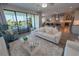 Bright living room with comfortable seating and a view of the lanai at 13103 Monach Isles Dr, Riverview, FL 33579