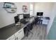 Office space with built-in desk and shelving, perfect for working from home at 13103 Monach Isles Dr, Riverview, FL 33579