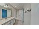 Bathroom with white single sink vanity, tile flooring, and a shower and tub combo at 13640 Forest Lake Dr, Largo, FL 33771