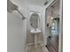 Powder room with pedestal sink and decorative lighting fixtures at 13640 Forest Lake Dr, Largo, FL 33771
