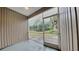 Enclosed lanai with tiled flooring and screened windows overlooking the backyard at 13640 Forest Lake Dr, Largo, FL 33771
